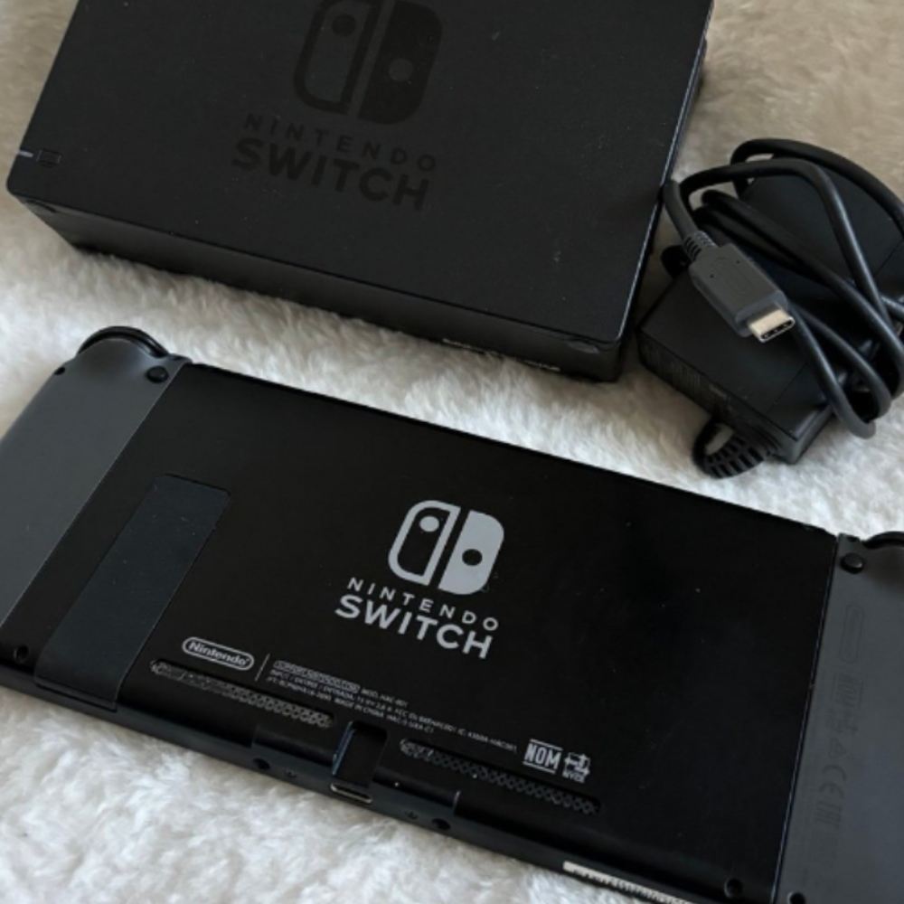Nintendo switch console, charging dock, controllers, 3 games, plus accessories